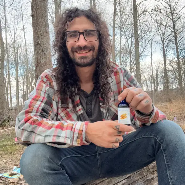 Thomas Tovar, founder of Red Road Wellness, in a Pacific Northwest forest